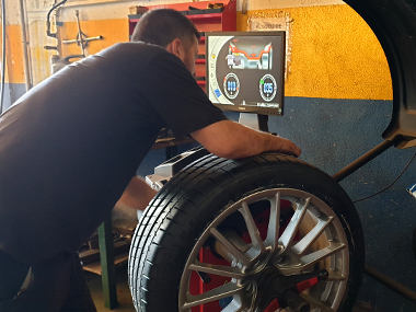 Porsche Panamera 4 Tyre being balanced at workshop Porsche Tyre being balanced